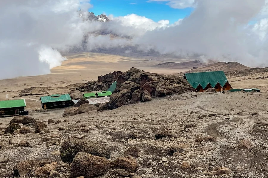 Kibo hat camp with green roofed buildings